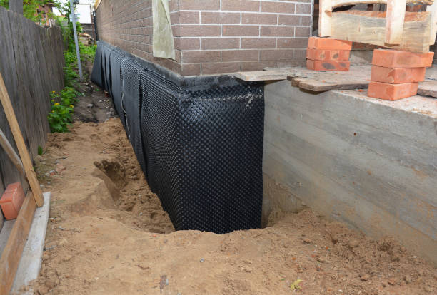 Happy homeowners after waterproofing job in Gowen
